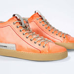 Men's ORIGINAL LC17 High-top Handpainted Orange Canvas offers a sleek and breathable style, perfect for long warm days.