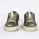 Front view of low top aged khaki sneaker with white accents. Perforated khaki leather upper with red stitching and pale rubber sole.