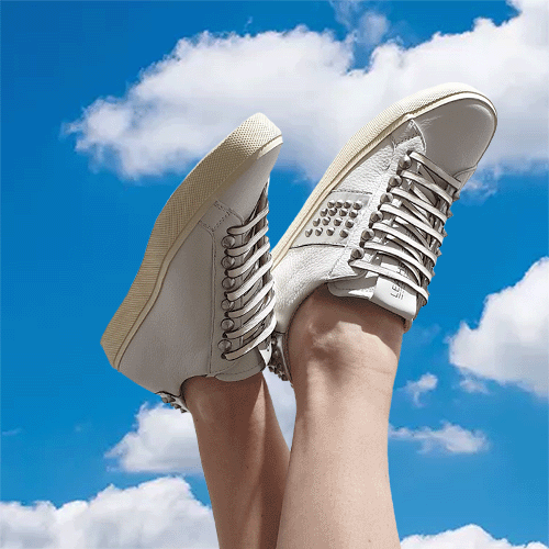 Studlight style wearing worn against a backdrop of blue sky.