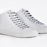 Three quarter front view of mid top white sneaker with full leather upper with perforated crown logo and white sole.