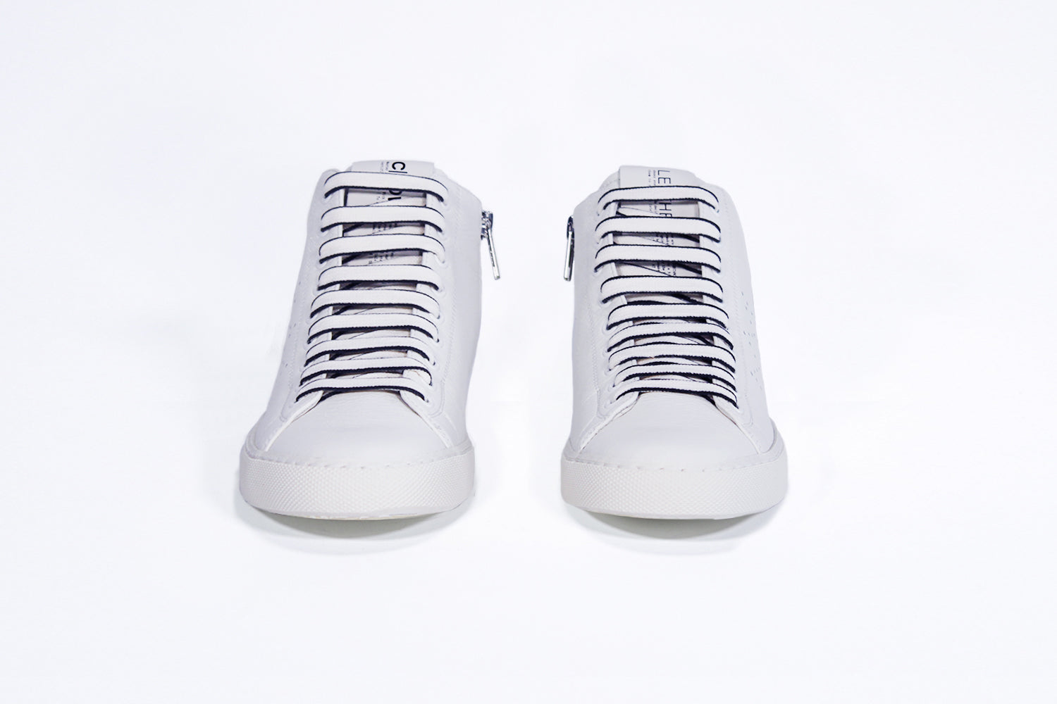 Front view of mid top white sneaker with full leather upper with perforated crown logo and white sole.