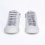 Front view of mid top white sneaker with full leather upper with perforated crown logo and white sole.