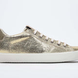 Women's Low-top PURE sneaker in Metallic Gold Leather with a sleek side profile perfect to add shine to any outfit.