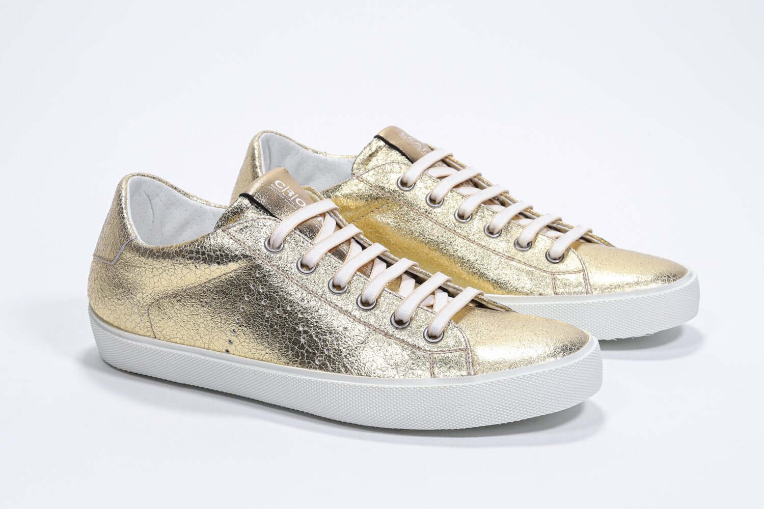 Women's Low-top PURE sneaker in Metallic Gold Leather showing white cotton laces and a low top line.