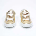 Women's Low-top PURE sneaker in Metallic Gold Leather - the perfect sneakers to elevate any outfit.