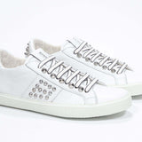  Women's Low-top STUDLIGHT in White Leather and Silver Studs sneakers offers an edgy and clean silhouette.